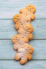 a stack of gingerbread cookies on a blue wooden table - 396663222