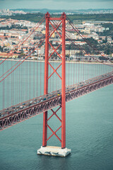 a great fast that stretches over the river. Bridge on April 25 in Portugal. A similar bridge as in...