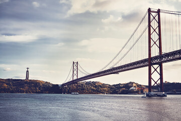 a large road bridge that stretches over the mountain river Tagus in Portugal. bridge on April 25