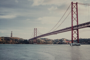a large road bridge that stretches over the mountain river Tagus in Portugal. bridge on April 25