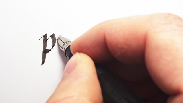 Writing of preface. Hand writing with a pen. Calligraphy closeup.