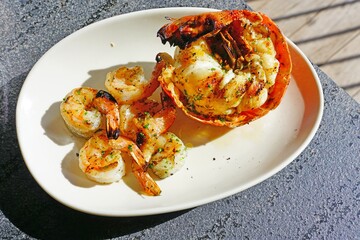 Plate of freshly grilled spiny lobster tails and grilled shrimp