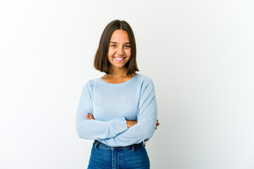 Young mixed race woman who feels confident, crossing arms with determination.