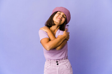 Naklejka premium Young mixed race woman hugs, smiling carefree and happy.