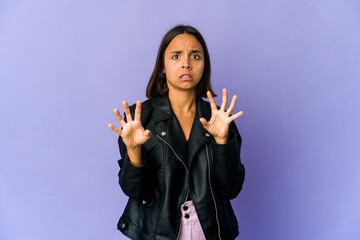 Young mixed race woman being shocked due to an imminent danger