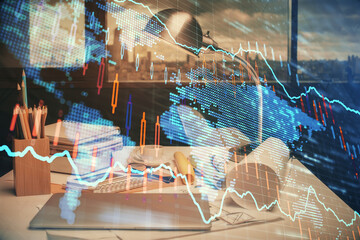 Double exposure of stock market graph drawing and office interior background. Concept of financial analysis.