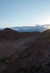 The red canyon and valley at sunset. Panorama view of the arid desert, sandstone formations, and rocky mountains in Talampaya national park in La Rioja, Argentina.
