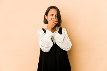 Young hispanic woman isolated suffers pain in throat due a virus or infection.