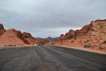 A road in a desert between red hills, Nevada