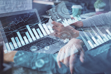 Double exposure of man and woman working together and forex chart hologram. Business concept....