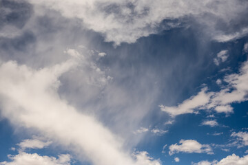 Wisps of White Cloud on Deep Blue Sky