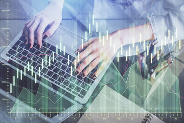 Double exposure of woman hands typing on computer and forex chart hologram drawing. Stock market invest concept.