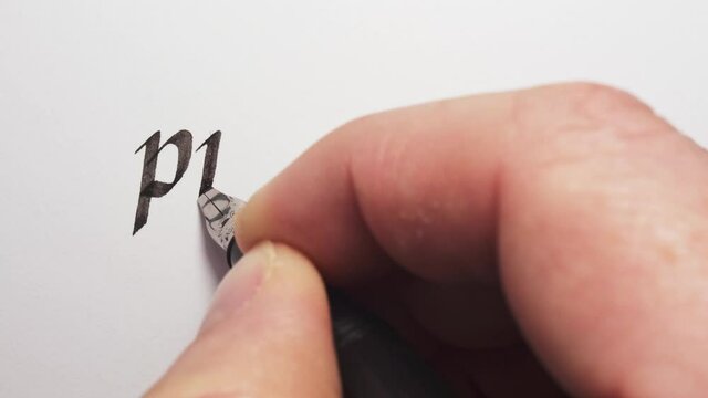 Writing of success prologue. Hand writing with a pen. Calligraphy closeup.