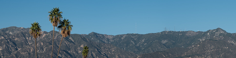 Panoramic view of the top of the San Gabriel Mountains as seen from Pasadena in Los Angeles County. The view includes the famous Mt Wilson Observatory.
