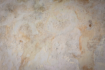Rain water leaks on the wall causing damage and peeling paint