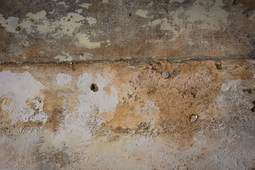 Rain water leaks on the wall causing damage and peeling paint