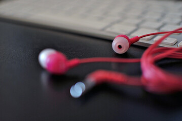 Pink headphones and keyboard