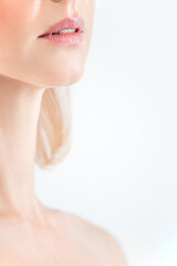 beauty portrait of a blonde woman's lips with a long neck close up on a white background