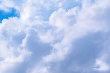 Naklejka na ściany i meble Cumulus clouds in a blue sky