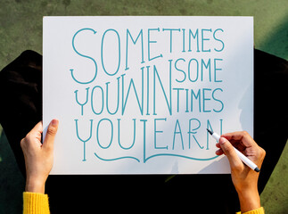 A female artist working on hand lettering