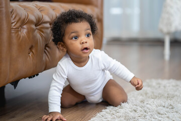 Happy African American Little baby boy crawling and looking for some thing to learn