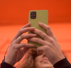 Woman's hands holding a phone