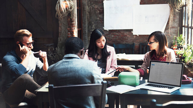 Diverse business colleagues meeting in a cafe