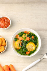 Sayur Bening Bayam is Daily Menu in Indonesian family, made from Spinach, Carrot, and Corn. Spiced with Garlic  and Salt. Served with Various Side Dish like Tofu or Fried Salted Fish and Sambal.