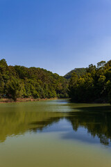 Fototapeta na wymiar Landscape of a lake, Country Park, Blue sky and white clouds.