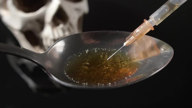 Filling syringe with drug, closeup