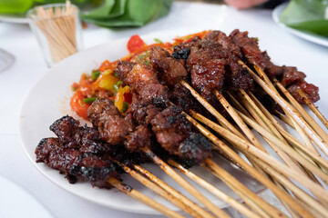 One of the typically Indonesian foods is satay or sate. This food is made from beef or mutton or chicken which is grilled over smoky coals then served with peanut sauce and soy sauce.