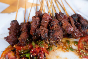 One of the typically Indonesian foods is satay or sate. This food is made from beef or mutton or chicken which is grilled over smoky coals then served with peanut sauce and soy sauce.