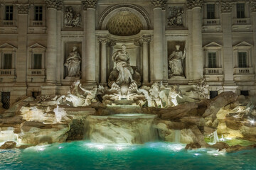 Fototapeta na wymiar Trevi Fountain is the most beautiful fountain in Rome. Interestingly enough, the name of Trevi derives from Tre Vie (three ways), since the fountain was the meeting point of three streets.