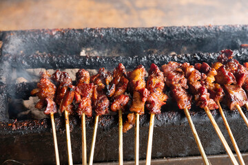One of the typically Indonesian foods is satay or sate. This food is made from beef or mutton or chicken which is grilled over smoky coals then served with peanut sauce and soy sauce.
