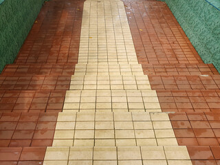 Fototapeta premium The stair steps are made of red and brown granite background.