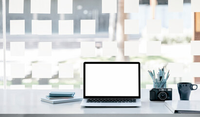 Fototapeta premium Mockup blank screen laptop with stationary on white top table.
