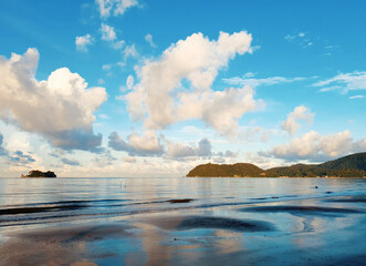 Beautiful Colorful Ocean Beach and blue sky as the background in Thailand.