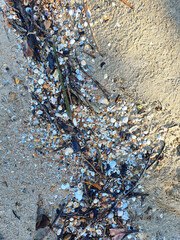 Closeup of Plastic waste on the beach Global problem of Environmental pollution concept with copy space the background in Thailand.