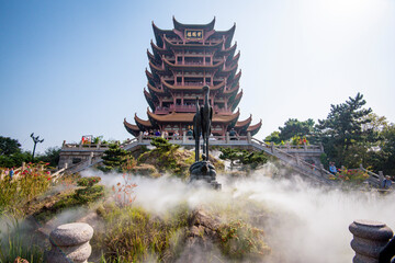 Yellow Crane Tower against blue sky in Snake Hill, Wuhan, China. The three Chinese characters mean...