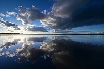 Colorful sunset cloudscape reflected in tranquil Coot Bay in Everglades National Park, Florida on calm autumn afternoon.