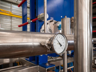 Industrial thermometer on a stainless steel pipe