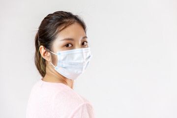 Asia woman wearing an anti virus protection mask to prevent others from corona COVID-19 on white background
