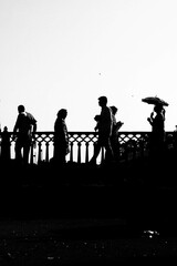 Fototapeta na wymiar silhouettes of people walking