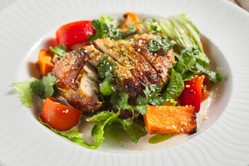 Chicken fillet with baked vegetable salad