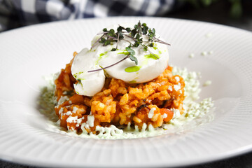 Tomato Risotto with Burrata and Pesto. Gray vintage table