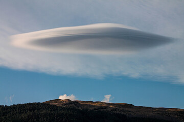 cloud over hill