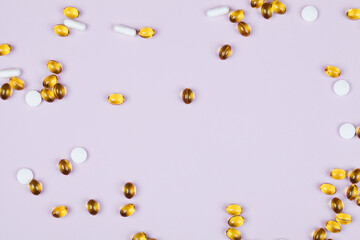 Close up vitamins and supplements on purple background