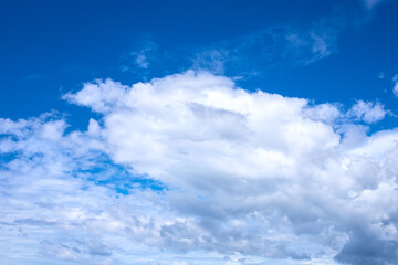 Obraz premium White fluffy cloud on azure blue sky. Single cloud abstraction. Abstract natural photo. Cotton softness concept. Zen or relax cover template. Cloudy sky overcast