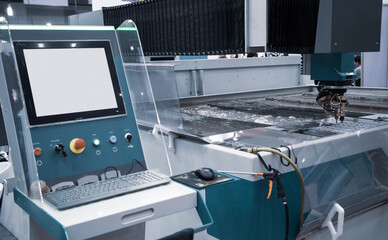 Modern CNC Abrasive water jet cutting machine using high pressure water jet to cut metal....