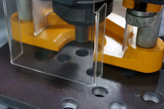 An acrylic cover safety guard in the metal machine in industry plant.  